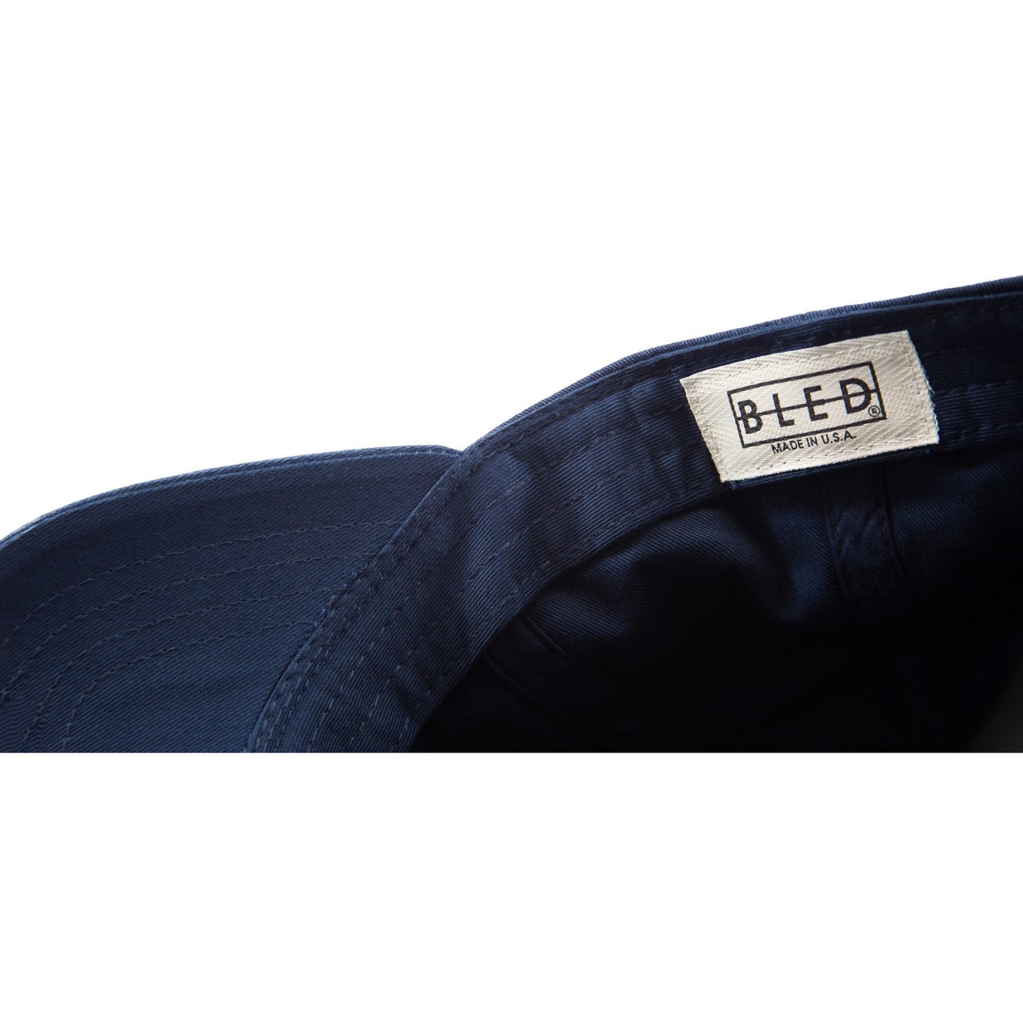 6-panel unconstructed Cotton navy dad hat featuring BLED letter logo felt patch on the front and BLED logo embroidered on the back with adjustable strap closure. skate, skateboarding, hype, streetwear