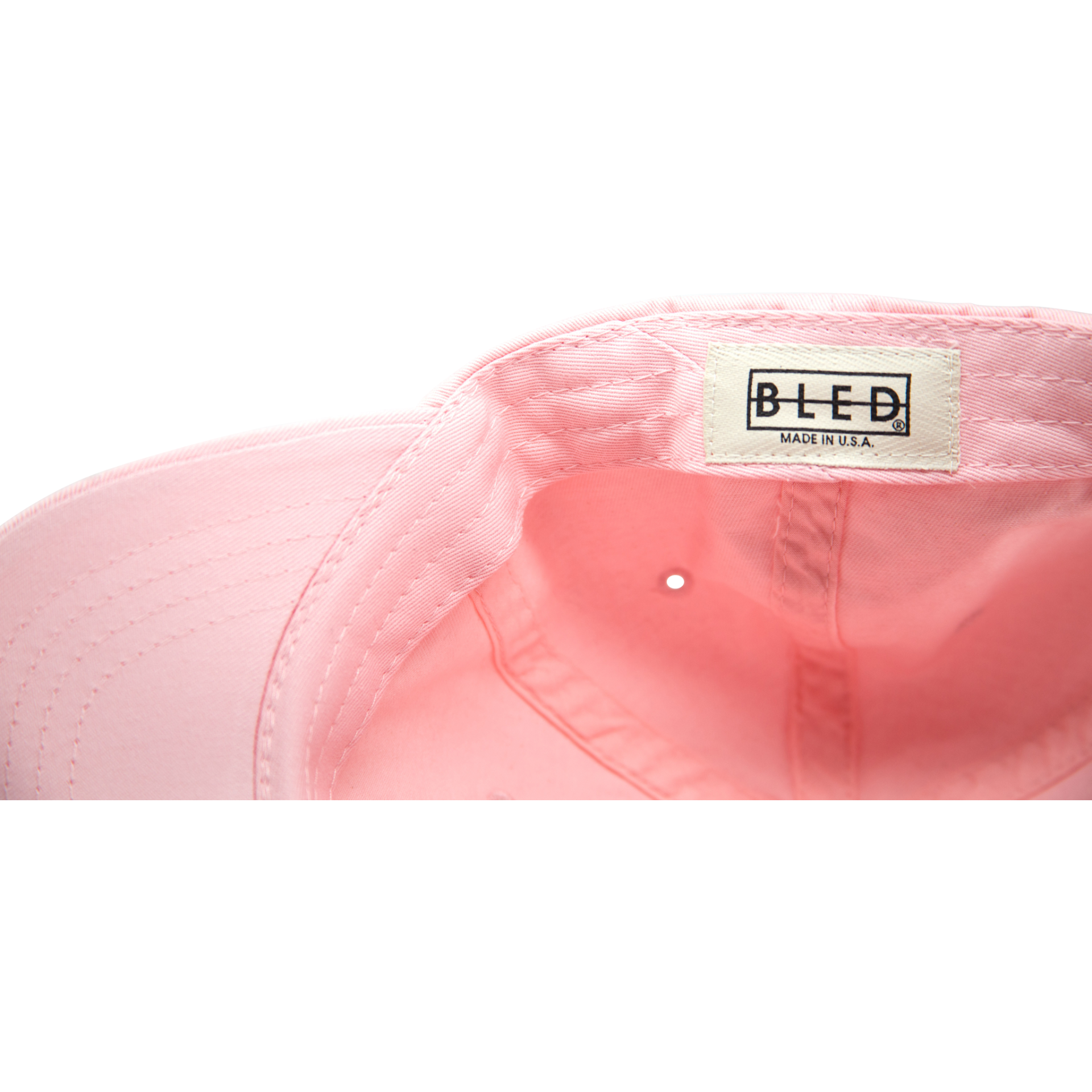 6-panel unconstructed 100% Cotton pink dad hat featuring evil eye embroidery on the front and Bled logo embroidered on the back. Third Eye Hat