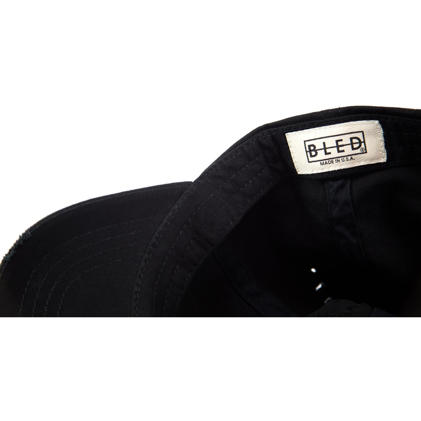 6-panel unconstructed 100% Cotton black distressed dad hat featuring evil eye embroidery on the front and Bled logo embroidered on the back. Third Eye Hat