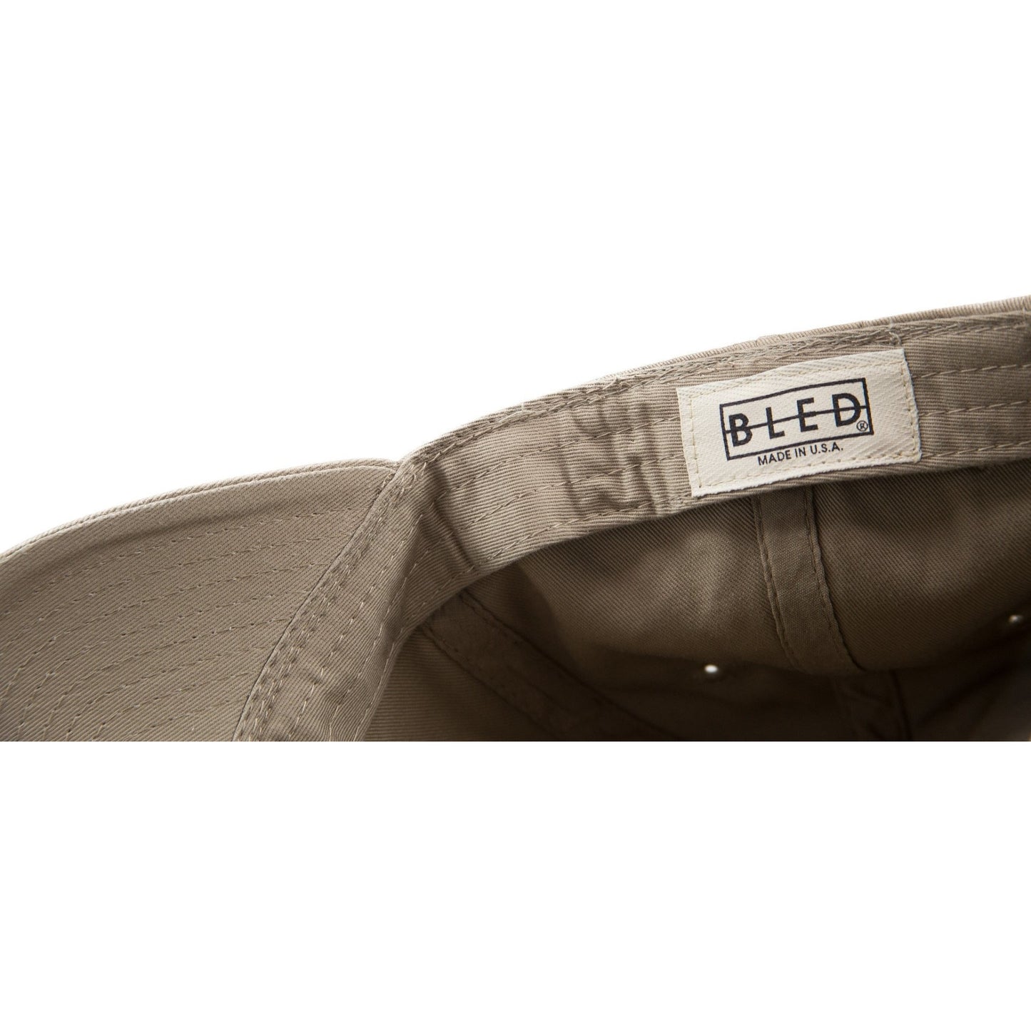 6-panel unconstructed Cotton tan beige dad hat featuring BLED letter logo felt patch on the front and BLED logo embroidered on the back with adjustable strap closure. skate, skateboarding, hype, streetwear